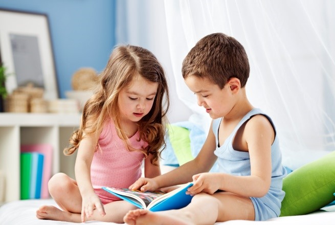 Children reading books and magazines
